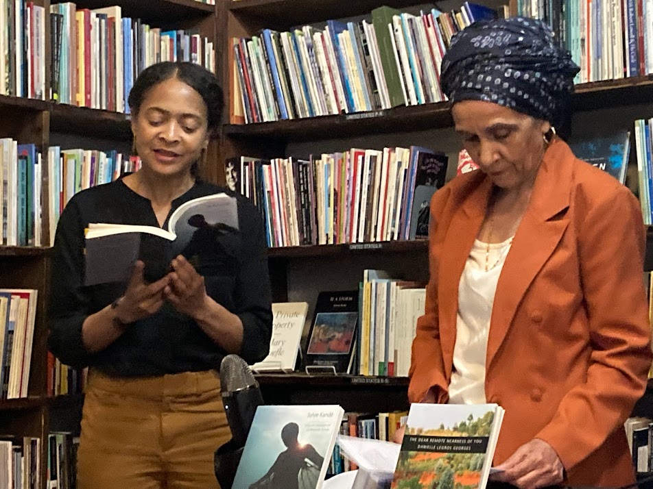 Danielle Legros Georges reading with poet Sylvie Kandé at Grolier Book Shop in Cambridge, Massachusetts, on May 18, 2022.