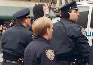 A photograph of police arresting a demonstrator at an anti-Bush and anti-war protest in February 15, 2003 in New York City