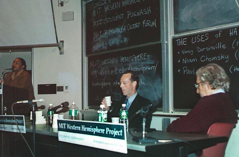 Paul Farmer with Noam Chomsky and Nancy Dorsainville at a conference in MIT.